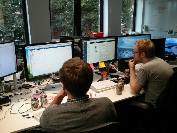 Two developers working on their hacks